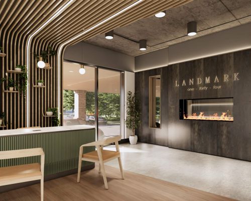 Modern lobby at Landmark at Dublin features wood accents, green plants, a fireplace, and a reception desk for welcoming Dublin apartments seekers.