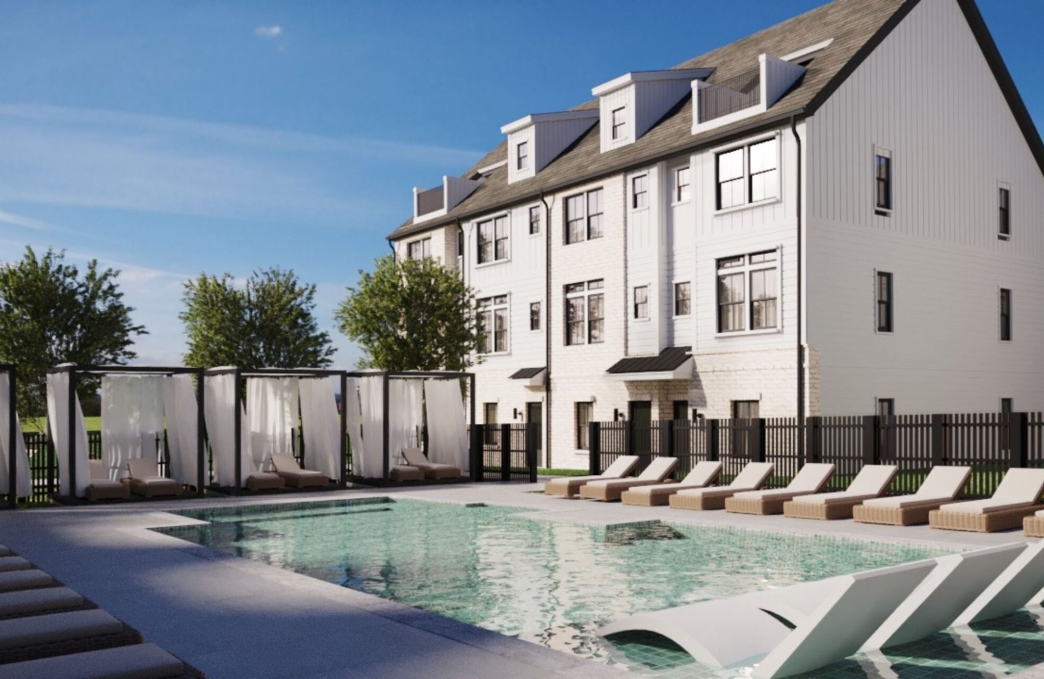 One West End offers a modern building with a pool, sun loungers, and cabanas nestled under the clear blue sky.