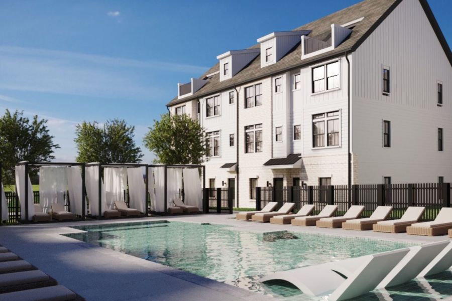 One West End offers a modern building with a pool, sun loungers, and cabanas nestled under the clear blue sky.