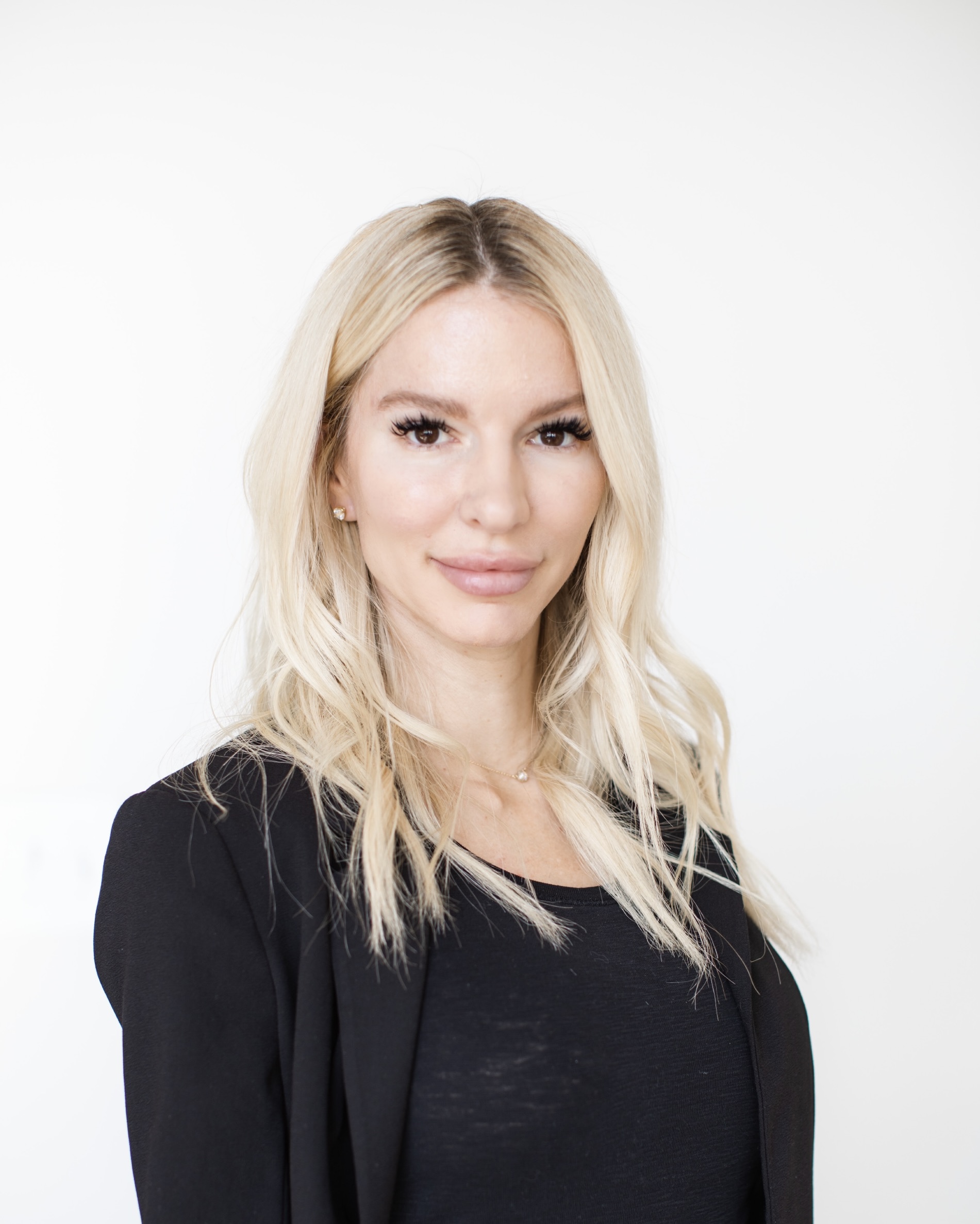 A woman with blonde hair, Tasha Kline is part of the Vest Residential property management team.